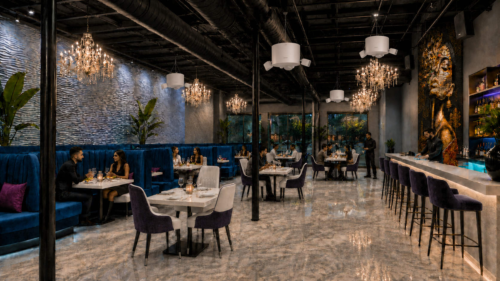 Dining room at ROHO 312 — velvet booths, chandeliers and the bar